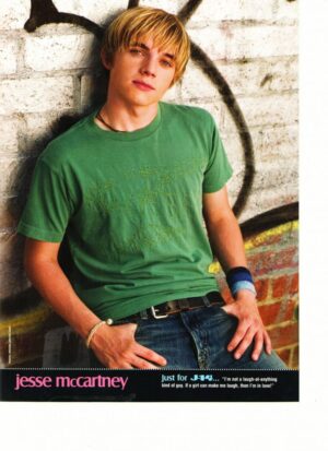 Jesse Mccartney by a brick wall bulge