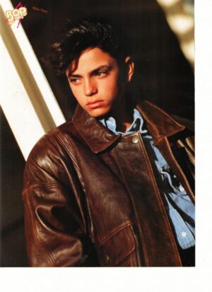 Mike Vitar in a brown leather jacket