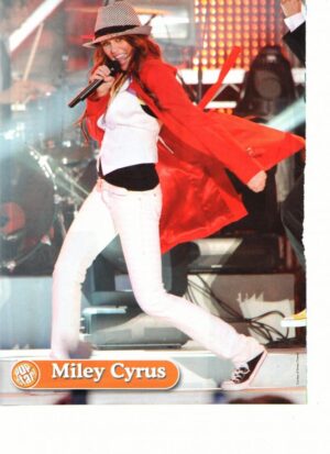 Miley Cyrus teen magazine pinup long white pants on stage pop Star
