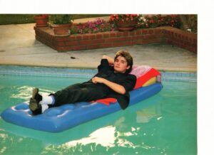 Corey Feldman pool laying down