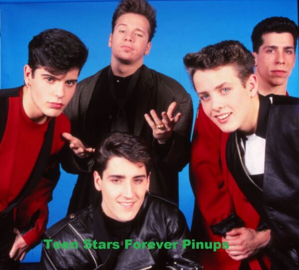 New Kids on the block red shirts squatting donnie wahlberg hands air