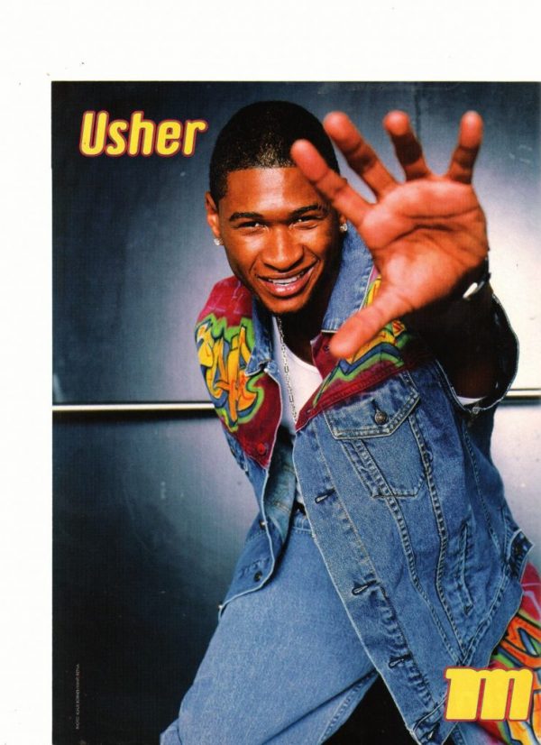 Usher wearing a jean jacket