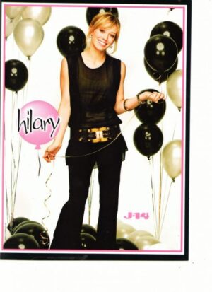 Hilary Duff holding black balloons