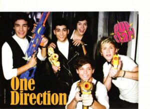 One Direction teen magazine pinup shooting nerf guns Pop Star