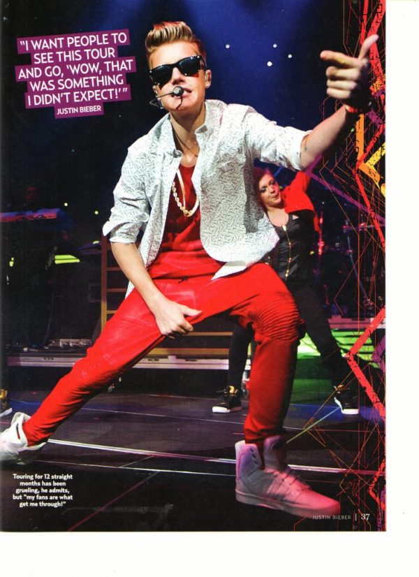 Justin Bieber teen magazine pinup red pants sunglasses on stage