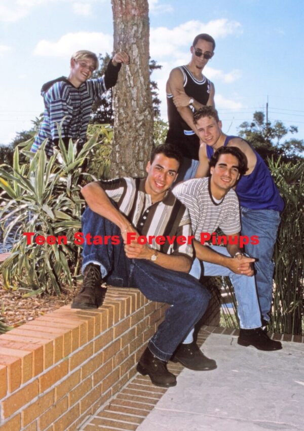 Backstreet Boys sitting brick wall young boys pre fame photo outside muscles Brian Littrell Nick Carter Aj Mclean Howie Dorough Kevin Richardson