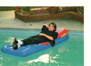 Corey Feldman pool wet swimming raft teen idol