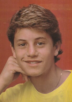 Kirk Cmaeron yellow shirt gold necklace hand on face Tutti Frutti teen magazine 80's teen idols