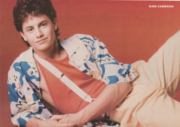 Kirk Cameron laying yellow pants orange shirt suspenders young child star tv star pinup pix 8 by 10