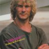 Patrick Swayze crossed arms green shirt pix outside