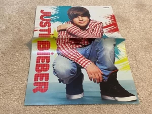 Justin Bieber teen magazine poster clipping young boy squatting jeans Holes